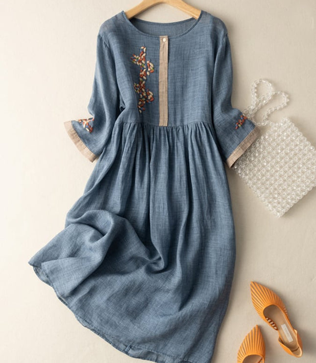 Blue women's summer embroidered midi dress with gathered waist and floral sleeve accents