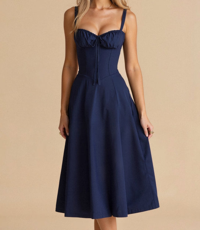 Front view of a navy blue summer midi dress with a corset bodice and adjustable straps.