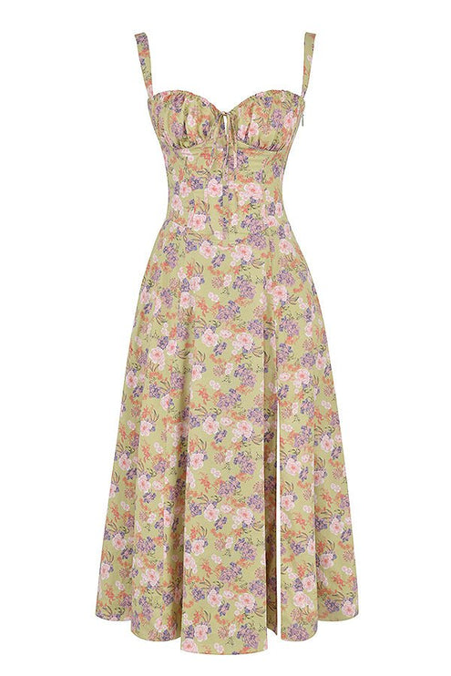 Flat lay of a green floral midi dress with pink and purple flowers, corset top, and side split.