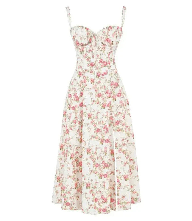Flat lay of a white floral midi dress with pink rose print, corset design, and a side split.