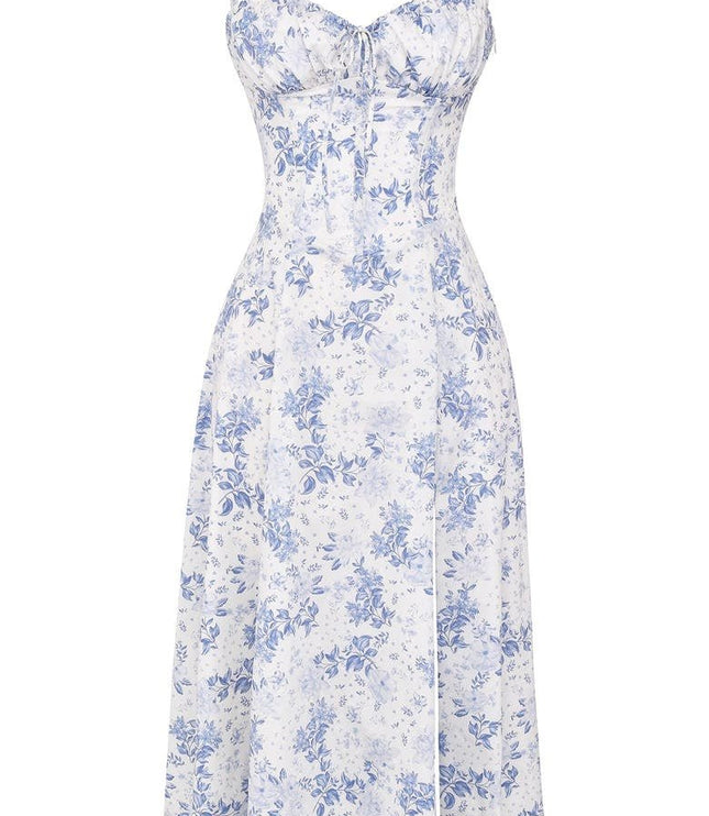White women's summer floral midi dress with blue flower print, corset top, and a side split.