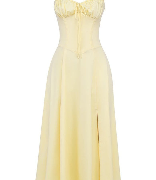 Pale yellow women's summer midi dress featuring a ruched corset bodice, thin straps, and a side split.