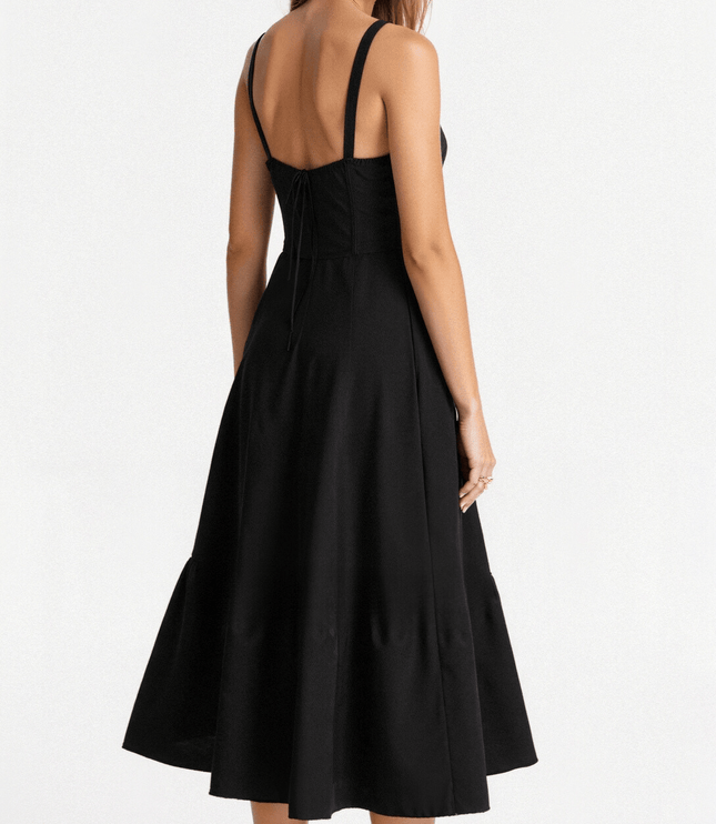 Rear view of a black corset midi dress featuring a lace-up back detail and a full, flowing skirt.