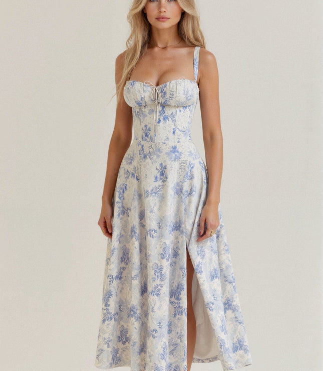 White and blue floral corset midi dress with a front side split and intricate blue floral design.