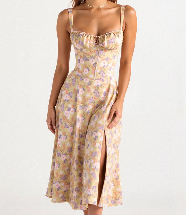 Yellow floral corset midi dress with delicate pink and purple flowers, front side split, and thin straps.