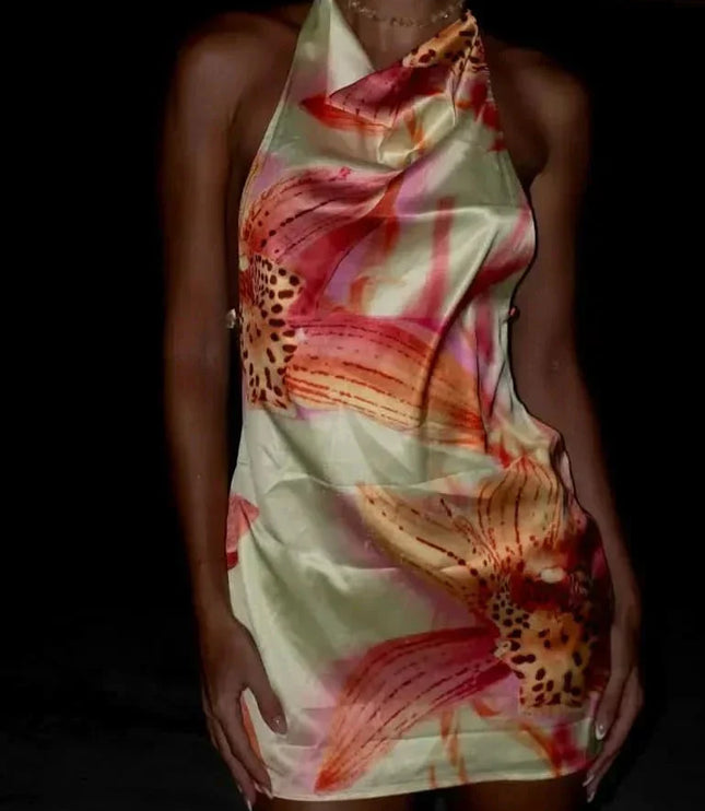 Rear view of open-back floral mini dress with halter tie and low-cut back detail