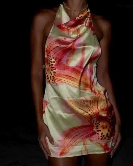 Three-quarter back view of floral summer dress with low open back and fitted mini skirt