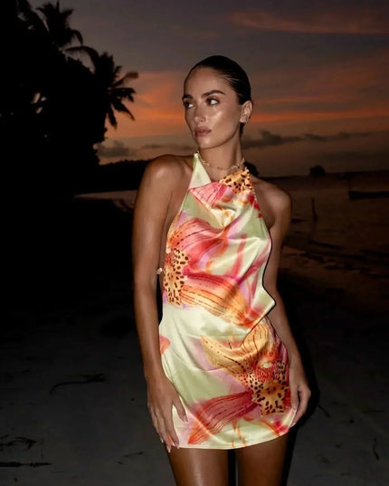 Women’s floral halter mini dress with pastel tropical print and fitted silhouette