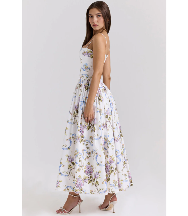 Side view of a women's floral maxi dress showing a fitted waist and flowing summer dress skirt