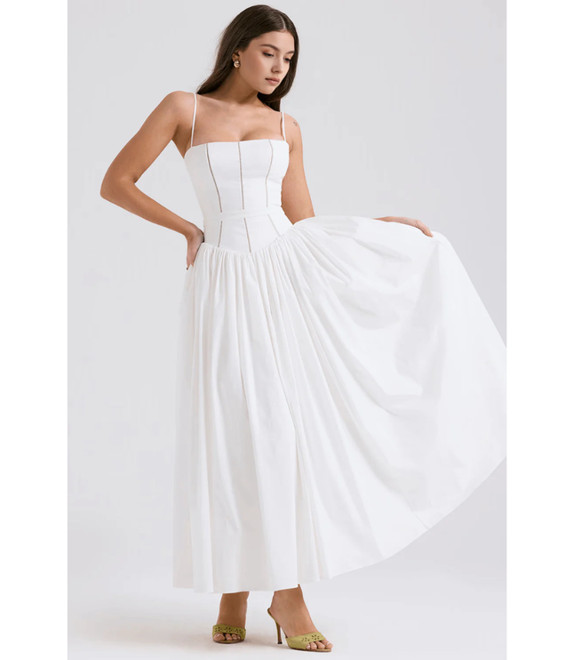 White summer maxi dress with square neckline and full skirt held out to the side