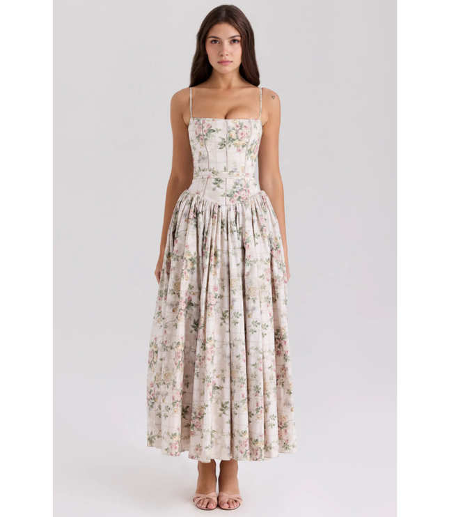Front view of floral maxi dress with thin straps, corset-style bodice, and gathered skirt
