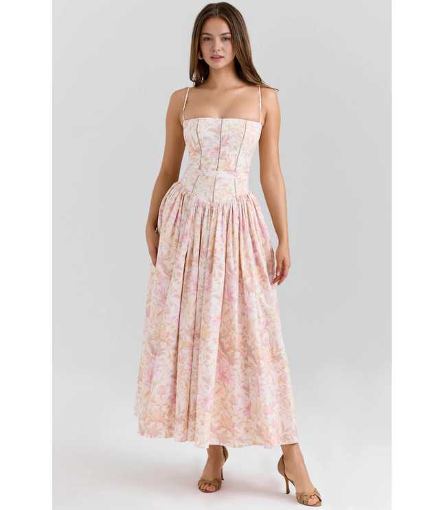 Close-up of women's floral maxi dress bodice with straight neckline, thin straps, and corset seams
