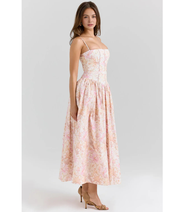 Women's pastel floral maxi dress with spaghetti straps, fitted waist, and soft pink print