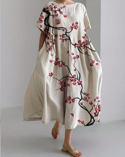 White floral midi dress with black branch print and red blossoms, loose summer dress