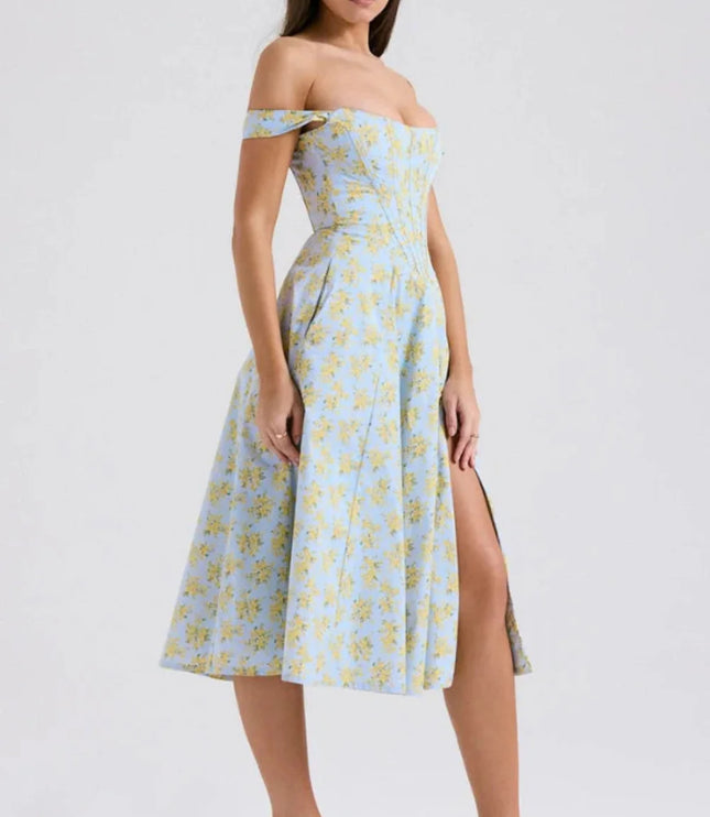 Side view of a floral off shoulder midi dress with fitted bodice and front slit