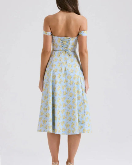 Back view of a blue floral off shoulder midi dress with ruched back and midi length