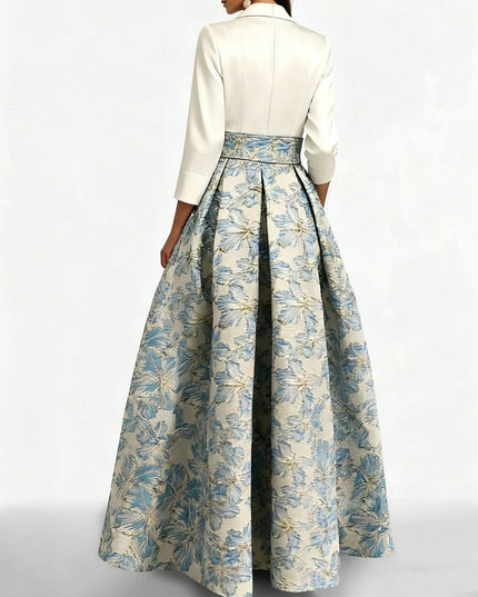 Back view of cream shirt collar dress with pleated floral ball gown skirt