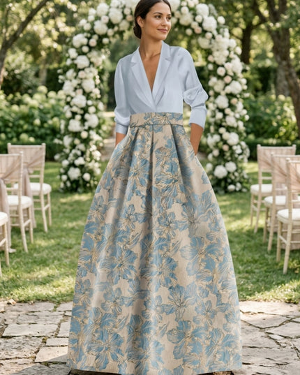 Woman wearing light blue collar shirt with blue floral maxi dress outdoors