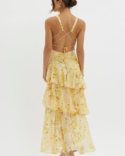 Back view of yellow floral midi dress with cross-back straps