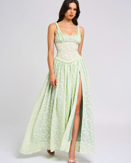 Front view of pale green floral sundress with high slit and fitted bodice