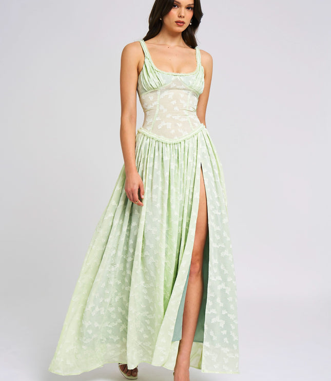Front view of pale green floral sundress with high slit and fitted bodice