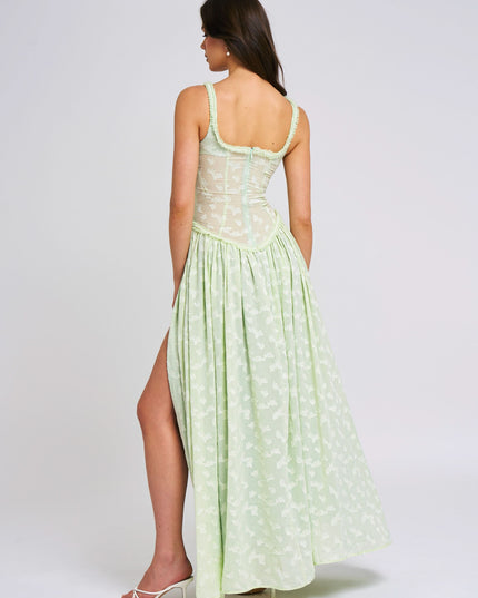 Back view of pale green floral maxi dress with scoop neckline and open back