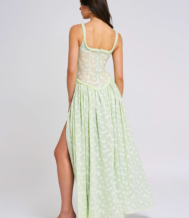Back view of pale green floral maxi dress with scoop neckline and open back