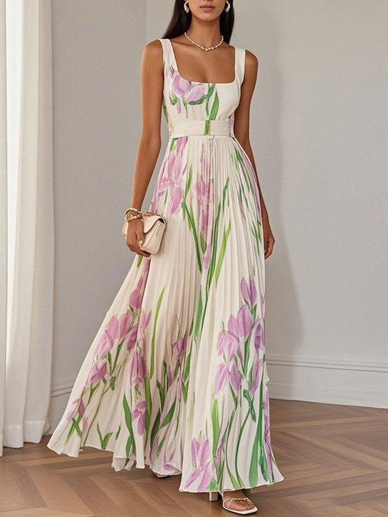 Full length women's sleeveless maxi dress with square neck, belted waist and flowing floral skirt