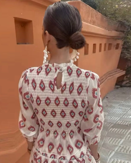 Back view of women's summer floral long sleeve mini dress with keyhole detail