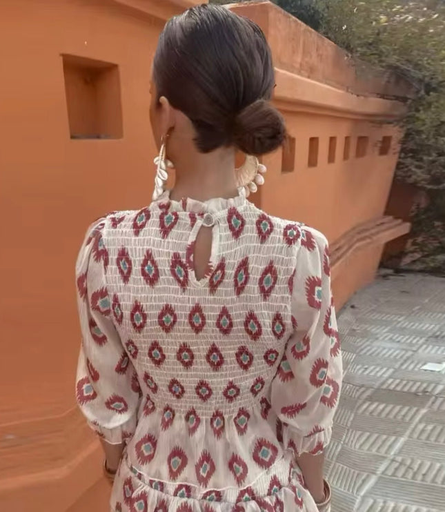 Back view of women's summer floral long sleeve mini dress with keyhole detail