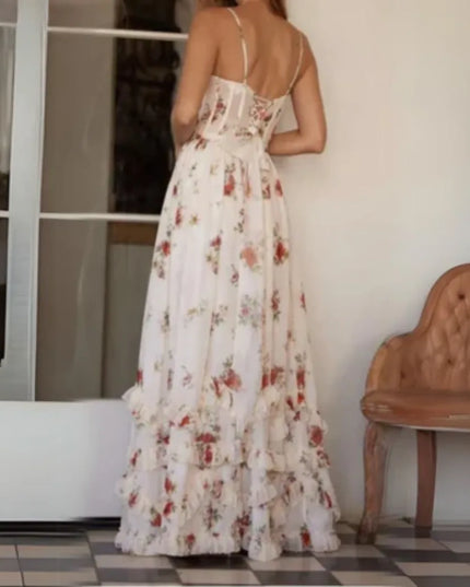 Back view of cream floral spaghetti strap maxi dress with fitted waist