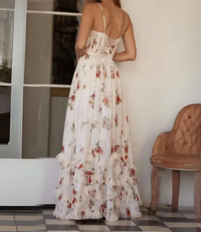 Back view of cream floral spaghetti strap maxi dress with fitted waist