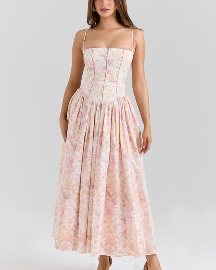 Front view of a women's pink and orange floral spaghetti strap midi dress with a fitted bodice.