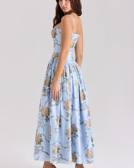 Back profile of a light blue floral spaghetti strap midi dress, highlighting the elegant silhouette.