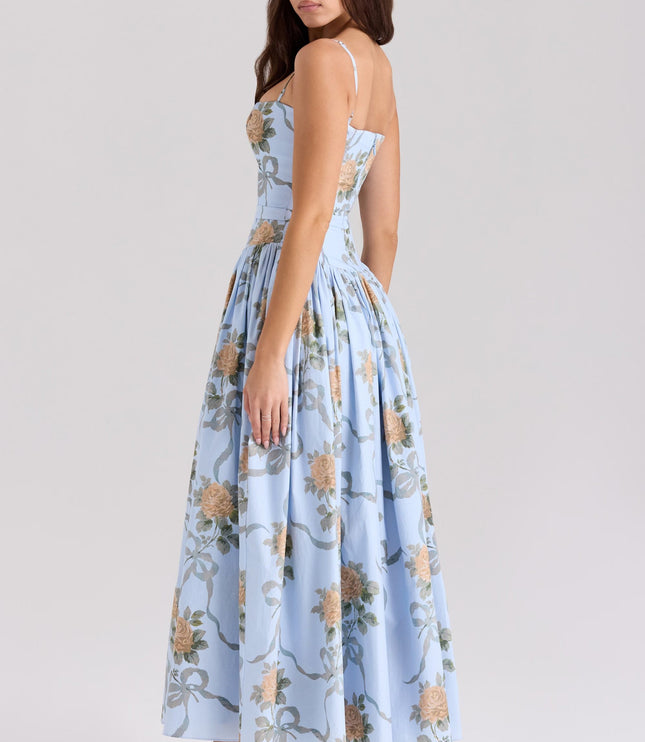 Back profile of a light blue floral spaghetti strap midi dress, highlighting the elegant silhouette.