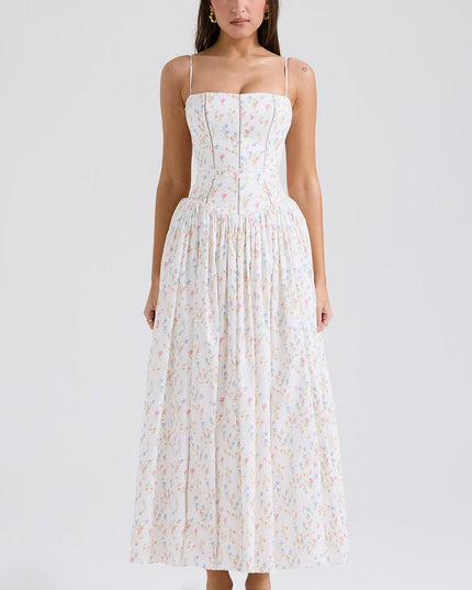Full-length white floral spaghetti strap midi dress with delicate colorful flower print and fitted bodice.