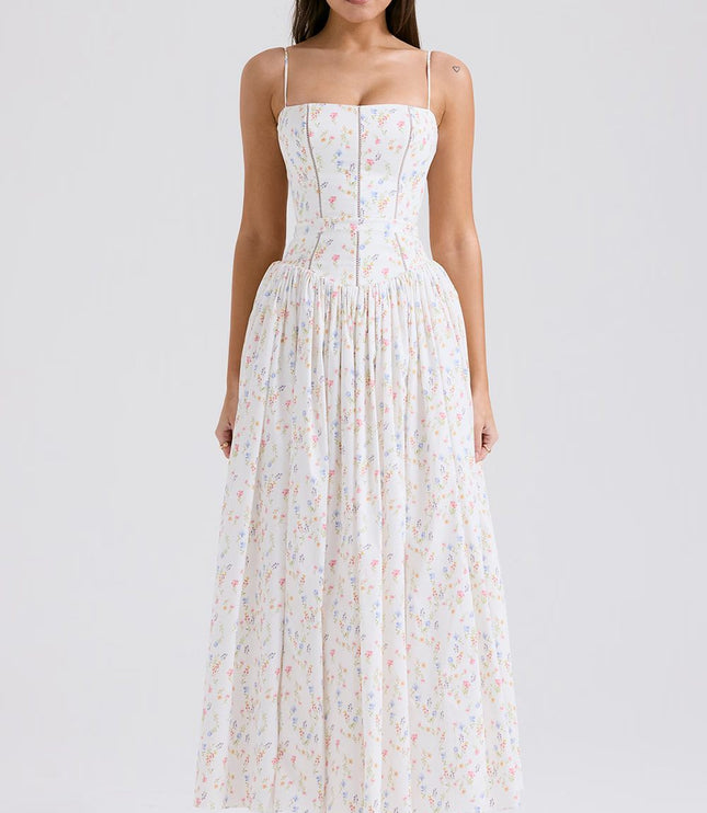 Full-length white floral spaghetti strap midi dress with delicate colorful flower print and fitted bodice.