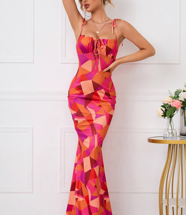 Front view of a square neck floral maxi dress with tie straps and bodycon fit in pink and orange