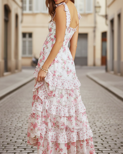 Side view of women's summer floral maxi dress showing open back and flowing tiered skirt