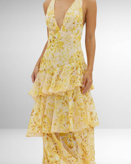 Close view of yellow floral V neck maxi dress with ruffled tiered skirt and sleeveless top