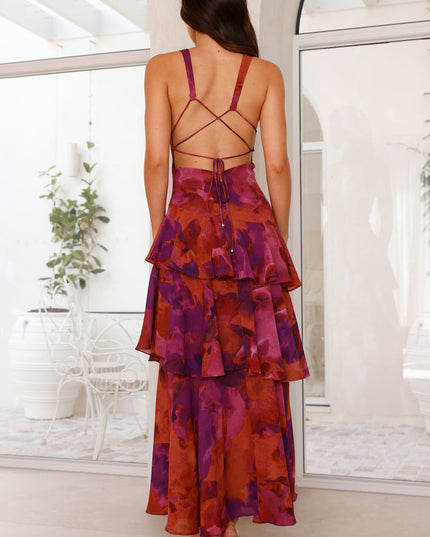 Back view of magenta floral maxi dress with crisscross strap back and layered skirt