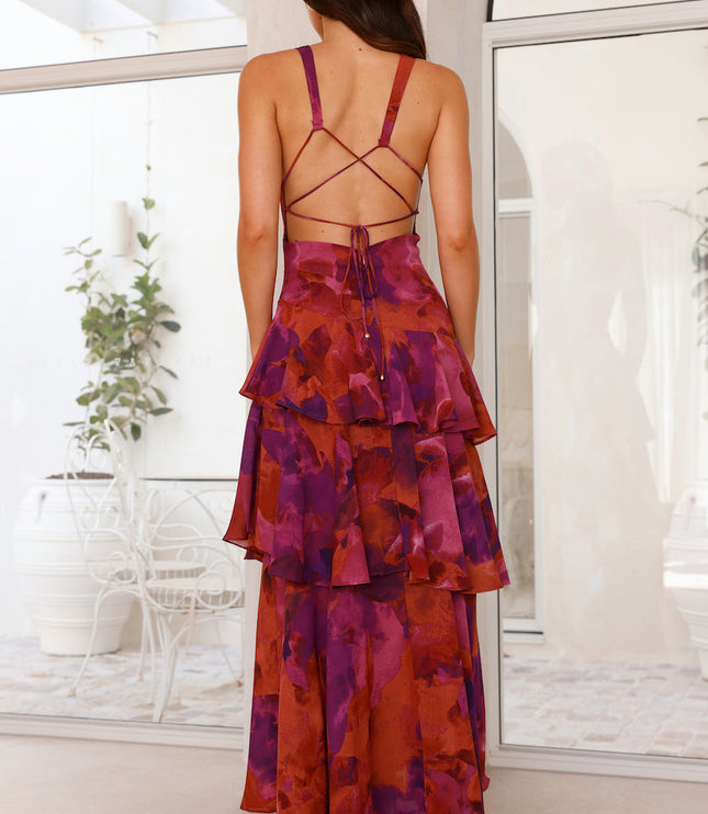 Back view of magenta floral maxi dress with crisscross strap back and layered skirt