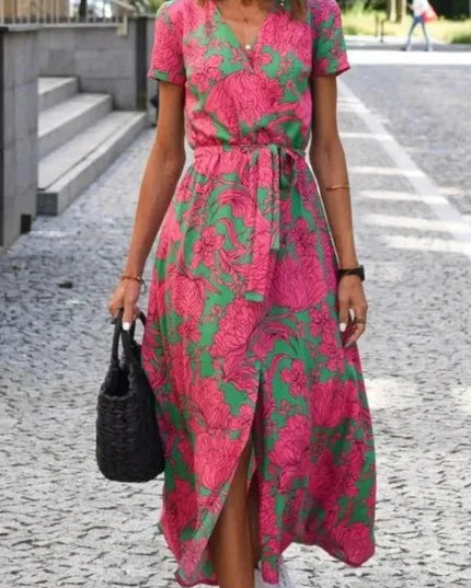 Front view of summer floral midi dress with V neck, tie waist, and front slit detail