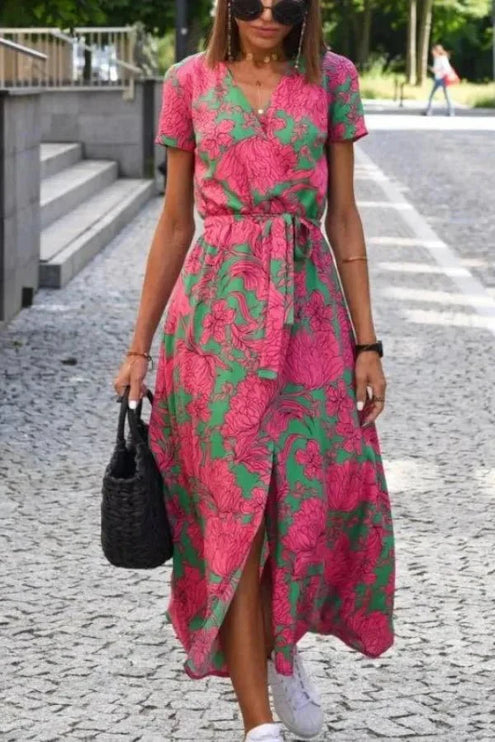 Front view of summer floral midi dress with V neck, tie waist, and front slit detail