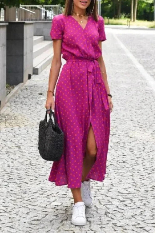 Women's magenta polka dot V neck midi dress with short sleeves, tie waist and front slit