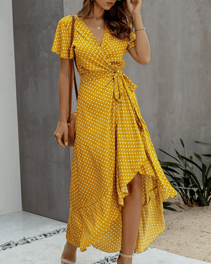 Mustard polka dot midi dress with V neck, flutter sleeves, wrap waist, and front slit