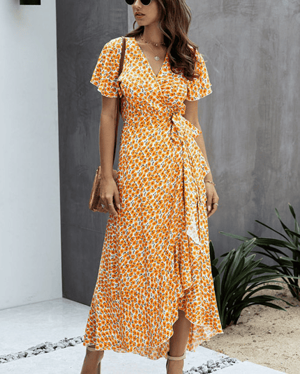 Orange floral wrap midi dress with V neck, flutter sleeves, and side tie detail