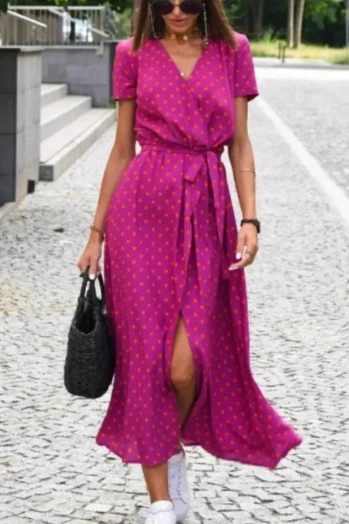 Women's floral V neck midi dress in pink and green with short sleeves, tie waist and slit skirt