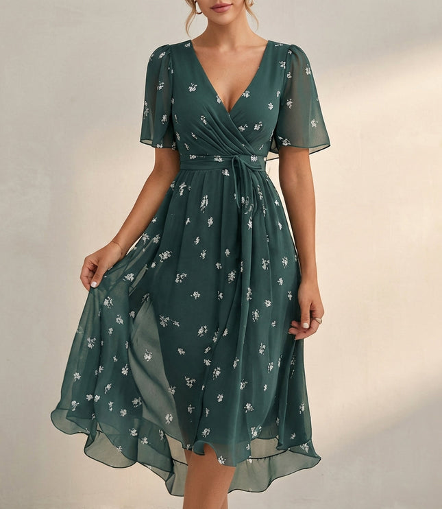 Green floral V neck mini dress with wrap front, short sleeves, and airy hem