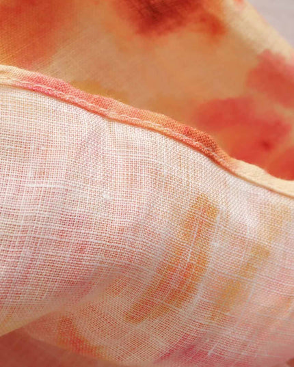 Sheer floral maxi dress fabric with soft orange and pink print, lightweight summer style